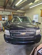 2007 Chevrolet Tahoe LT with 203,000 miles in a garage, great for family trips with third-row seating.