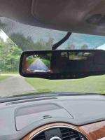 Rearview mirror display showing view of a path behind the 2012 Buick Enclave SUV.