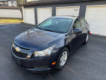 2014 Chevrolet Cruze 1LT sedan in good condition with 147,000 miles, featuring clean body and maintained interior.