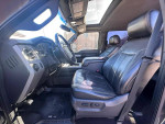 Interior view of a well-maintained 2015 Ford F350 Lariat with leather seats and sunroof