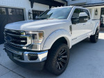 2021 Ford F350 Super Duty Crew Cab in white with 22-inch wheels and off-road features
