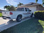 2000 Chevrolet S-10 LS 4WD in good condition parked in a driveway with green lawn