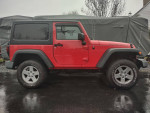 2009 Jeep Wrangler in red, showcasing its exterior and rugged design, available for sale at $10,750.