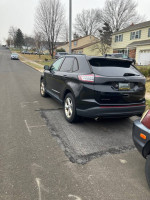 2016 Ford Edge parked on a residential street, showing signs of wear and a bad turbo issue.