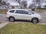 2013 Buick Enclave Limited in white parked on street, features leather interior and dual moonroofs
