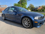 2004 BMW M3 in Mystic Blue color, 142k miles, showing the exterior and wheels parked on the roadside.