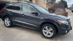 2014 Acura RDX in graphite luster with ebony interior parked outside, showcasing its design and features.