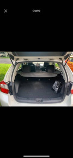 Interior view of Subaru Impreza hatchback trunk with ample space, showing neat condition and no stains.