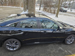 2021 Honda Civic EX sedan in excellent condition, parked with snow in background. Features sunroof and stylish design.