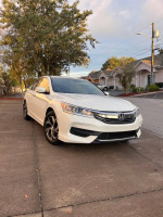 2016 Honda Accord LX in excellent condition parked on the street, showcasing its stylish design.