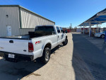 2006 Ford F-250 truck with a custom bumper and tool box in a well-maintained condition.