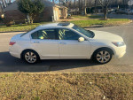 2008 Honda Accord EX-L parked on the street, featuring leather interior and sunroof, ideal for reliable driving.