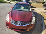 2012 Nissan Altima in maroon color, 98,000 miles, good condition, AC and heat functional, priced at $4950.