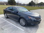 2014 Lincoln MKS sedan in good condition with no mechanical issues parked on pavement