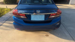 Rear view of a blue 2013 Honda Civic EX showing notable features and good condition.