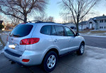 2009 Hyundai SantaFe AWD parked, showing clean exterior with clear blue sky.