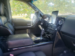 Interior view of a 2007 Ford F-150 Harley-Davidson with black leather seats and modern dashboard features.