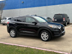 2019 Hyundai Tucson in excellent condition with leather seats and new tires parked outside.