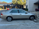 2007 Honda Accord LX Sedan in good condition, parked with shiny rims, featuring Bluetooth stereo, for sale.