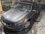 2010 Honda Accord EX-L in gray color parked at a gas station with a clean exterior and well-maintained wheels.