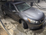 2010 Honda Accord EX-L parked at a car wash, featuring new tires and a sunroof.