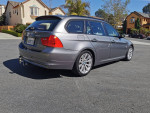 2011 BMW 3 Series wagon parked, showcasing its sleek design and sporty features, perfect for families and enthusiasts.