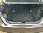 2023 Toyota Camry LE trunk space showcasing clean and spacious interior for storage.