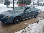 2007 Pontiac Grand Prix in good condition with new parts, parked in snow-covered area.