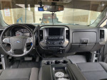 Interior view of a 2016 Chevrolet Silverado 1500 LT with a clean dashboard and modern controls.