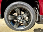 Close-up of a stylish black wheel on a 2014 Jeep Compass Latitude in excellent condition