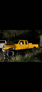 1990 Ford F250 IDI 7.3L Diesel truck, yellow exterior, rust-free, one owner from California, parked in grass.