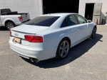 Clean 2013 Audi A8 with S8 appearance package parked, showcasing luxury and excellent condition.