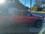 2003 Toyota Tacoma Pre-Runner in radiant red, offering reliable performance and off-road capabilities.