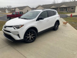 2016 Toyota RAV4 SE in Super White color parked on driveway with well-kept exterior and no visible damage.