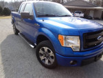 2014 Ford F150 STX extended cab in blue color, featuring stylish design and good tires.