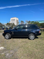2006 Land Rover Range Rover HSE in dark blue, parked outdoors, featuring a tan interior and 54,000 miles on the odometer.