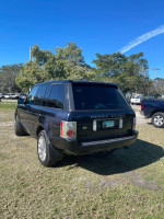 2006 Land Rover Range Rover HSE, dark blue SUV parked, showing good condition and strong V8 engine.