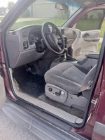Interior view of a 2004 Chevrolet TrailBlazer with clean seats and dashboard, showcasing its well-maintained condition.