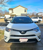 Front view of a well-maintained 2018 Toyota RAV4 Limited parked outside, showcasing its features.