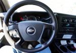 Dashboard of a 2008 Chevrolet Express van, showing steering wheel and gauge cluster.