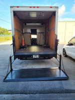 Interior view of a 2004 Chevy 3500 cutaway box truck with a liftgate and spacious cargo area.
