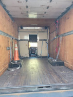 Interior view of a 2004 Chevy 3500 14ft box truck with liftgate and custom high-top features.