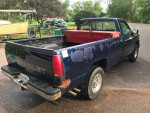 1993 Chevrolet pickup truck with low mileage, showing rust, tool box, and alloy rims.