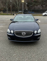 Front view of a blue 2008 Buick LaCrosse CX with chrome grille and detailed exterior