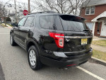 2014 Ford Explorer XLT FWD in black, showcasing stylish design and quality features, perfect for family adventures.