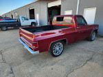 Fully restored 1981 Chevy C10 pickup with modern upgrades, showcasing its classic design and new features.