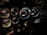 Modern digital gauges in a fully restored 1981 Chevy C10 pickup truck interior