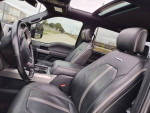 Interior view of a 2017 Ford F250 Platinum with leather seats and high-end features.