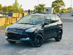 2016 Ford Escape Titanium FWD in excellent condition, featuring a sleek black exterior and advanced tech options.