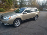 2010 Subaru Legacy Outback in excellent condition, gold color, all-wheel drive, 121,000 miles, one owner.